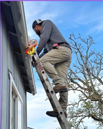 An extension ladder secured at the eave