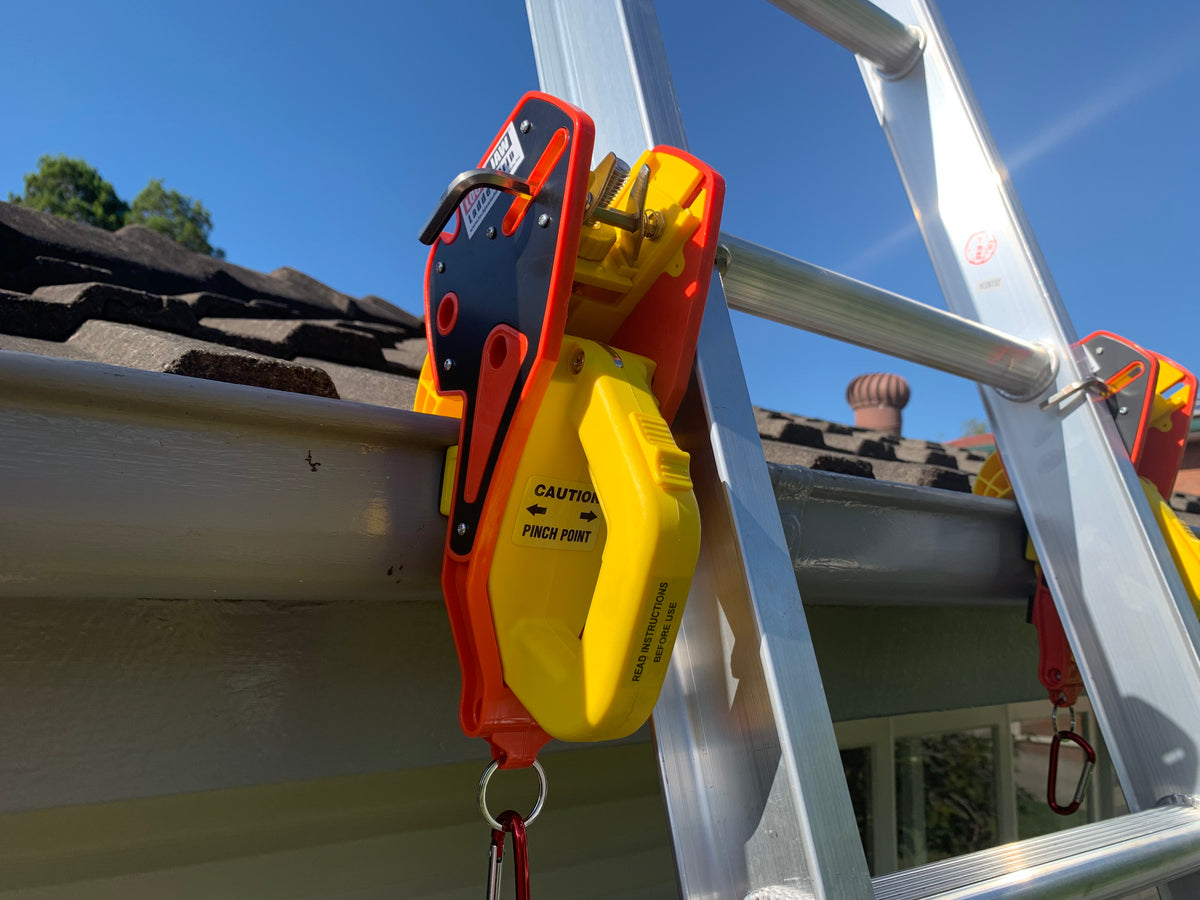 A Lock Jaw Ladder Grip, a fall prevention device, is attached to a ladder.