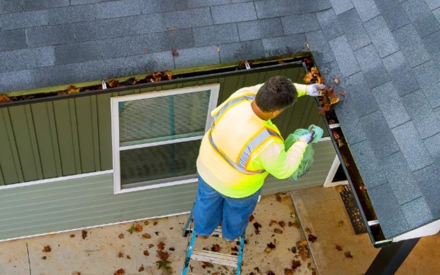 Two extension ladders secured to a roofline with Lock Jaw Ladder Grips